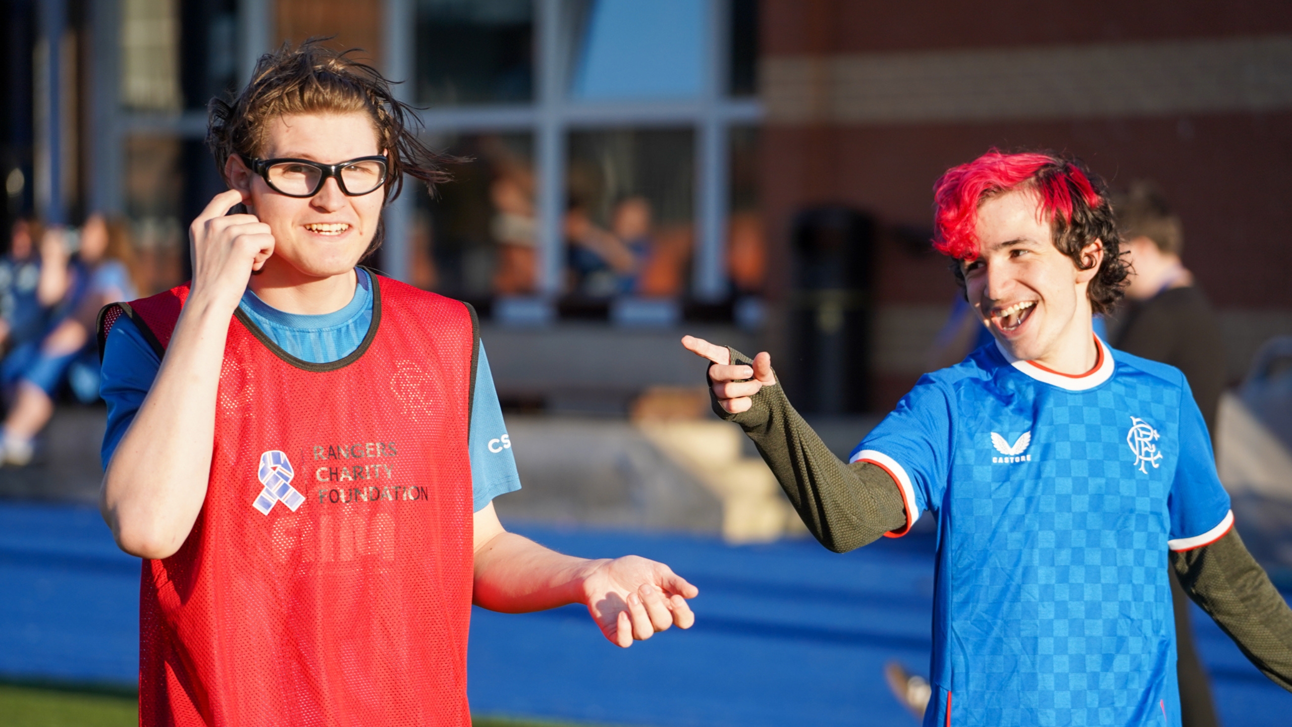 Two Count Me In participants having a laugh during a game of football