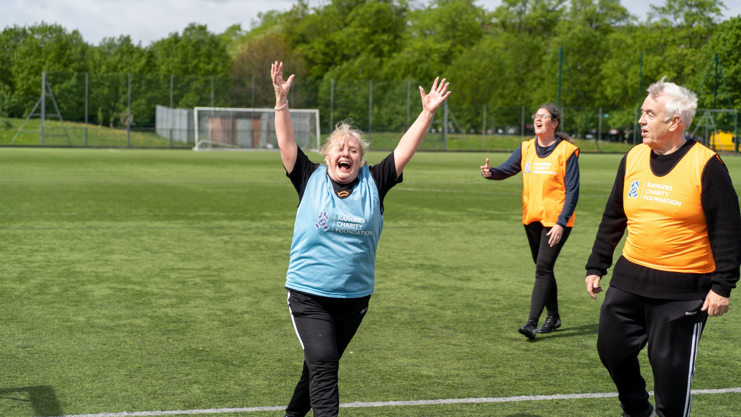 woman celebrates scoring a goal