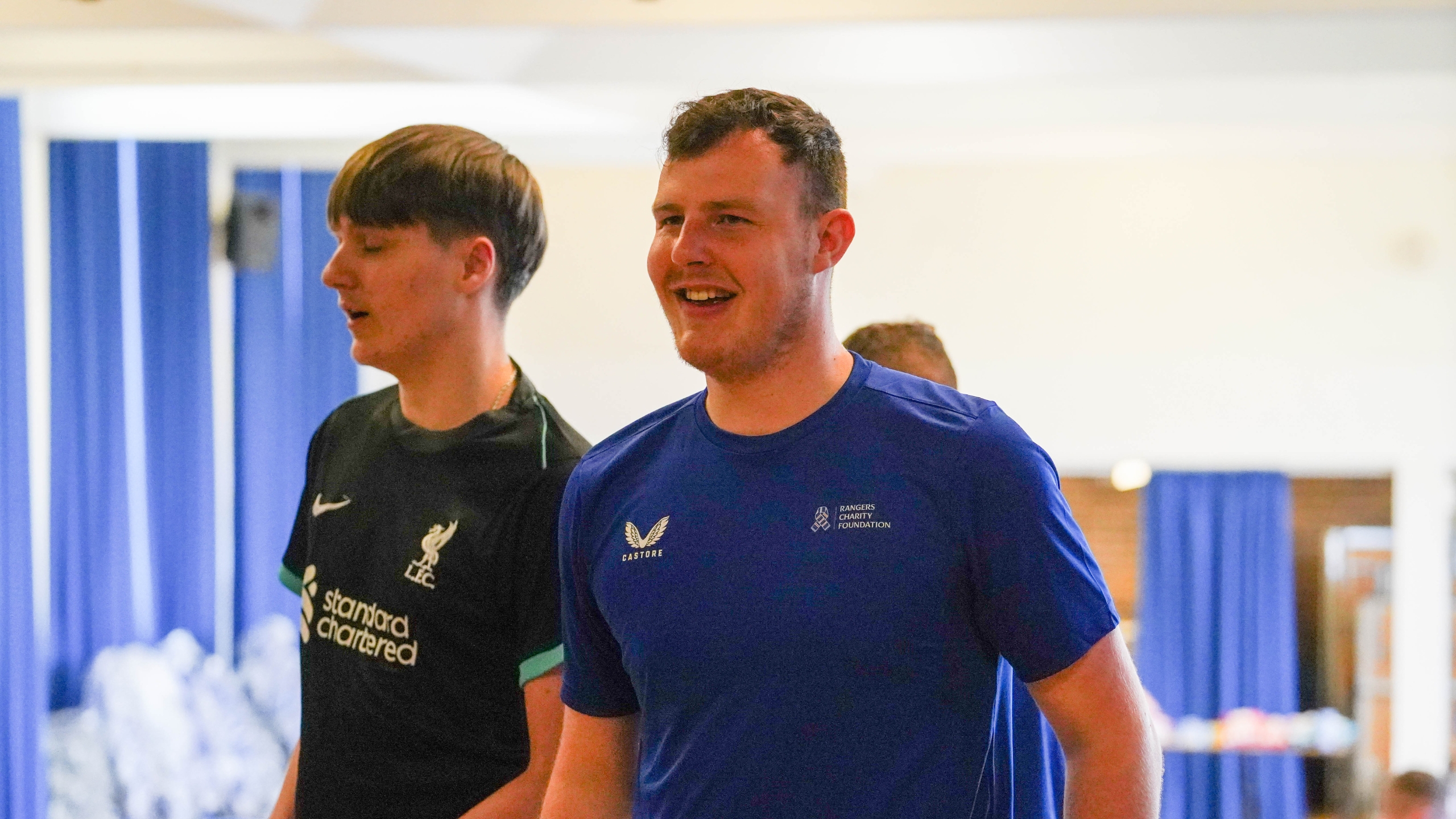 A Rangers Charity Foundation Community Hub Officer engaging with school students
