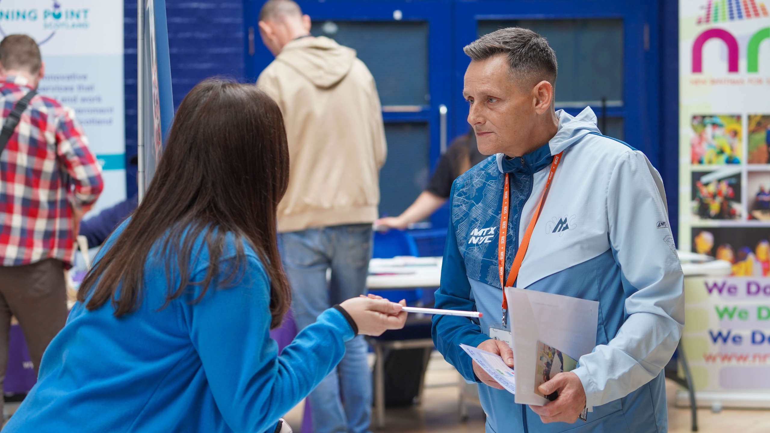 A man talking to a lady about recovery.
