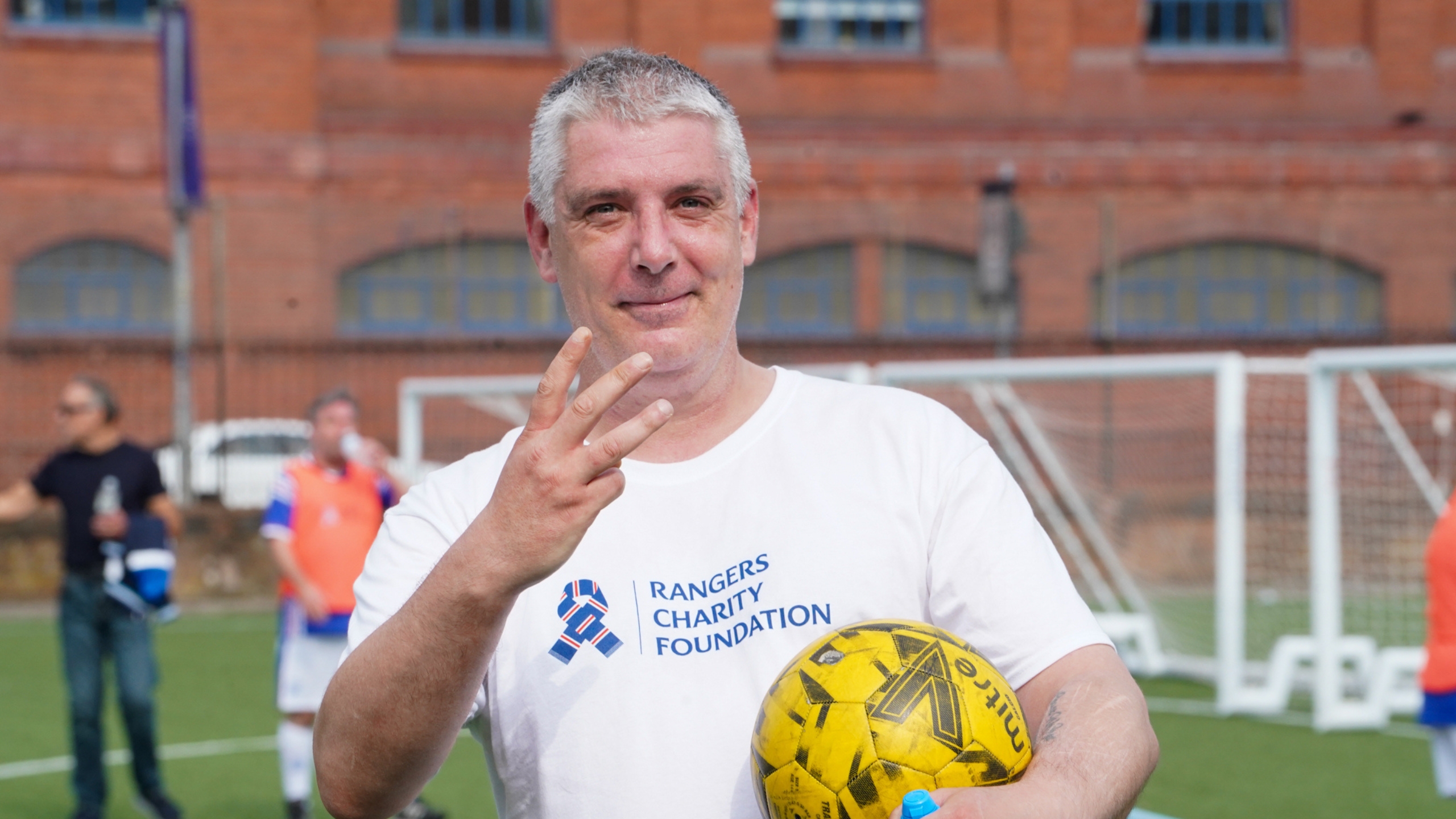 A man holding the matchball after scoring a hatrick