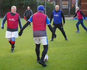 A group of men playing Walking Football