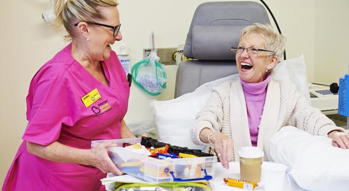 Staff and a patient enjoy a laugh during treatment at the Beatson