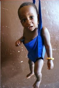 child being weighed