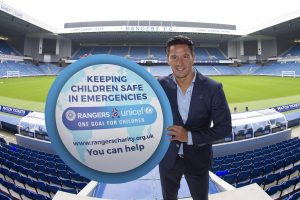 Michael Mols with unicef prop
