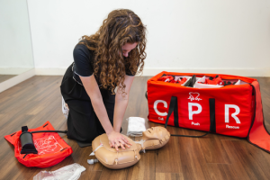 woman doing CPR