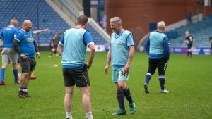 A group of Veterans playing football.