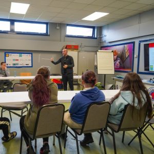 Police Scotland Community Officer engaging positively with young people during CashBack workshop