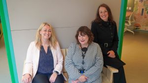 three women sitting on a bench in the Nook