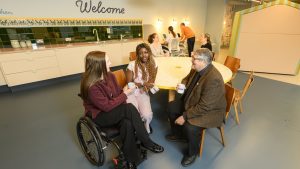 people sitting around a kitchen table