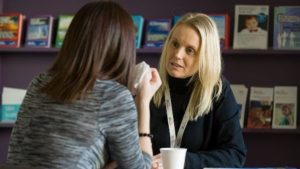 two women talking seriously