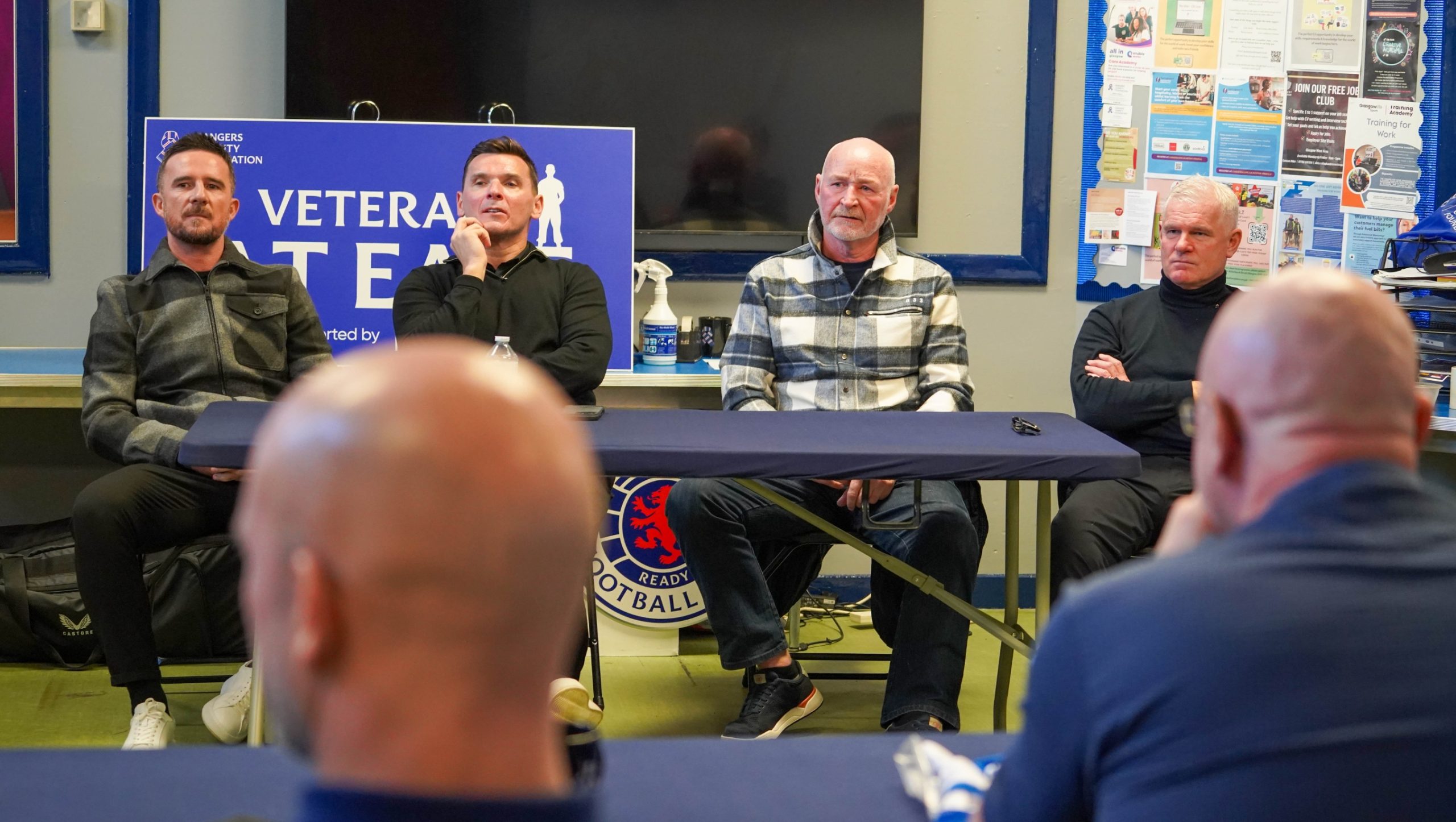 Barry Ferguson, Lee McCulloch, John Brown and Ian Durrant, sitting at a table talking to a group of Veterans.