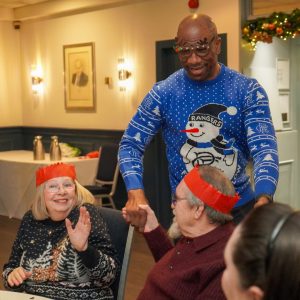 Marvin Andrews talking to Festive Friends Christmas lunch attendees.