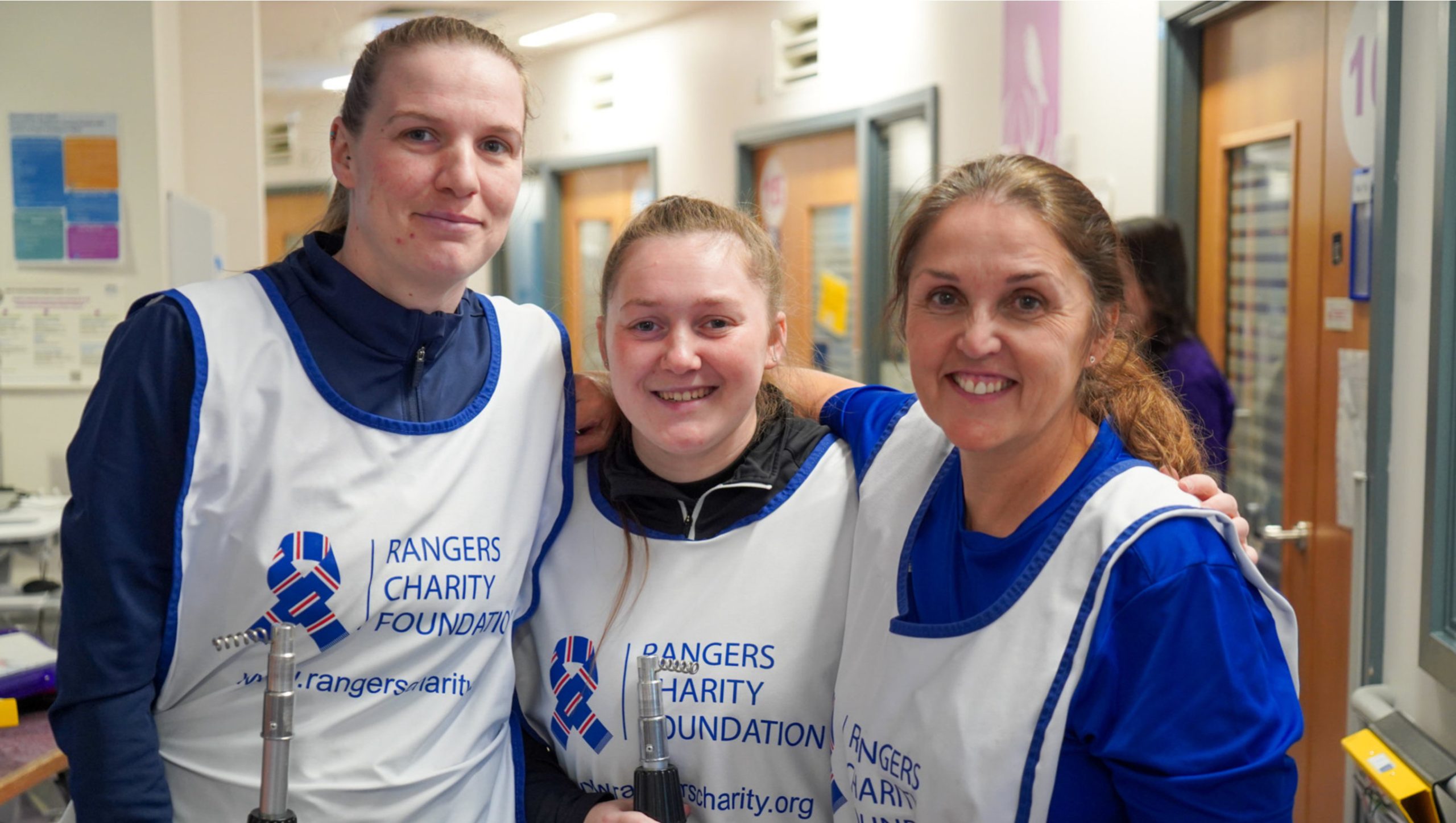 volunteers hanging Christmas decorations