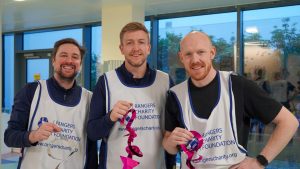 volunteers hanging Christmas decorations