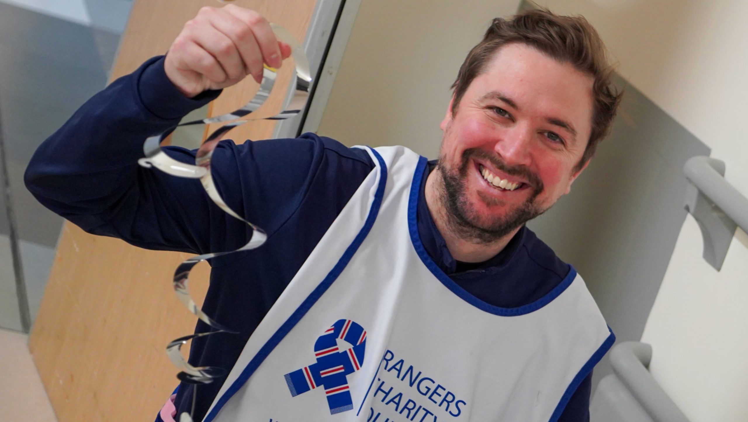 Foundation staff member hanging decorations