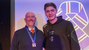 man with medal with rangers player