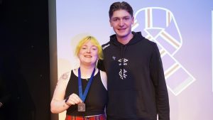 woman with medal with rangers player