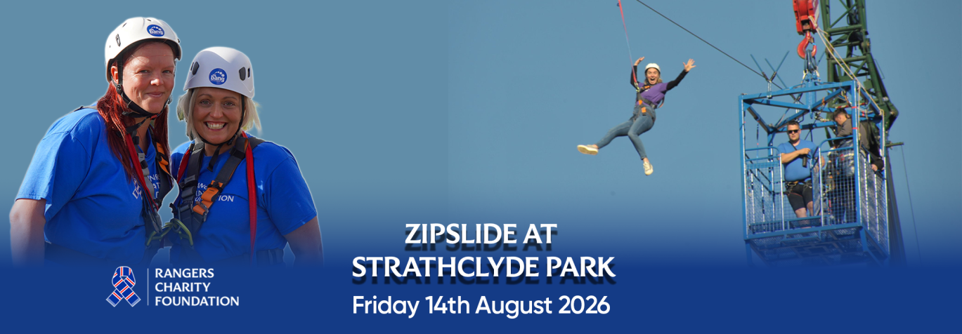 person in the air on a zipslide