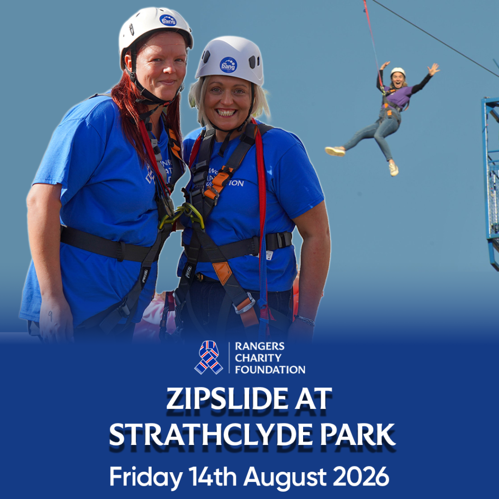 person in the air on a zipslide