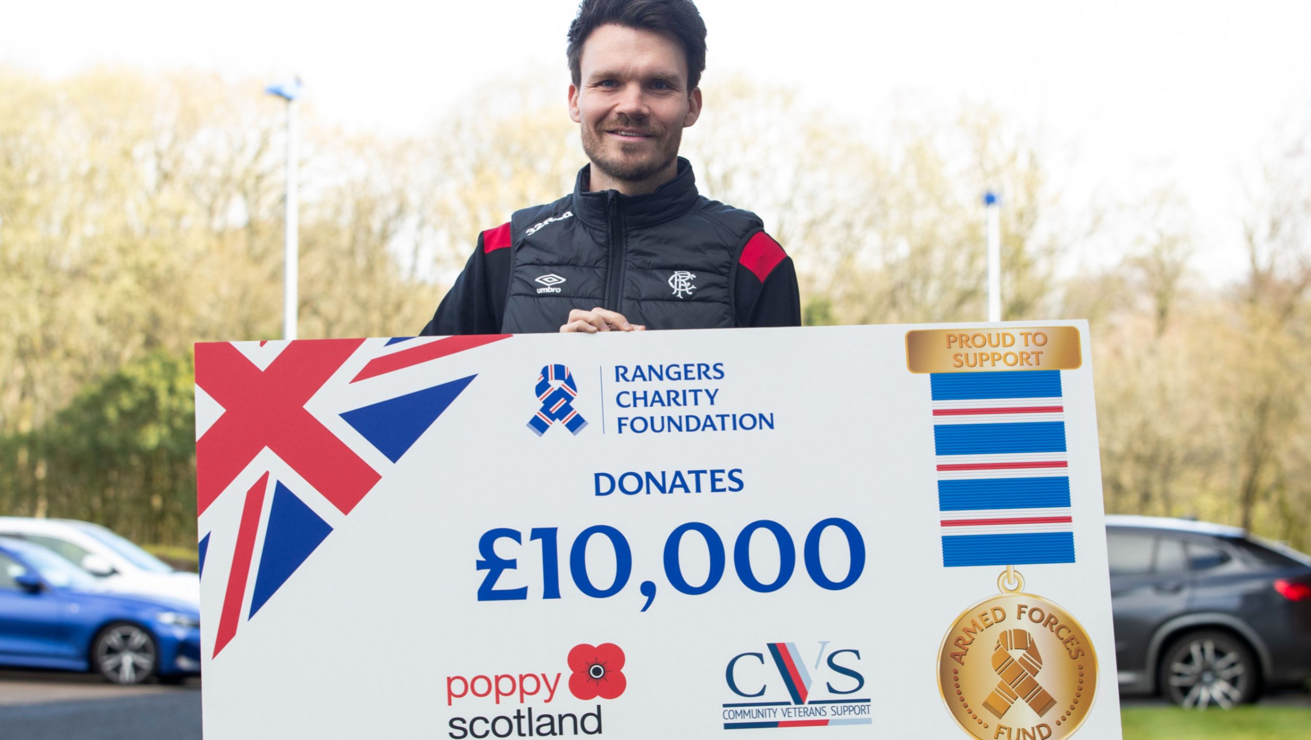 Danny Röhl Helps Mark £10K Donation to Armed Forces Partners