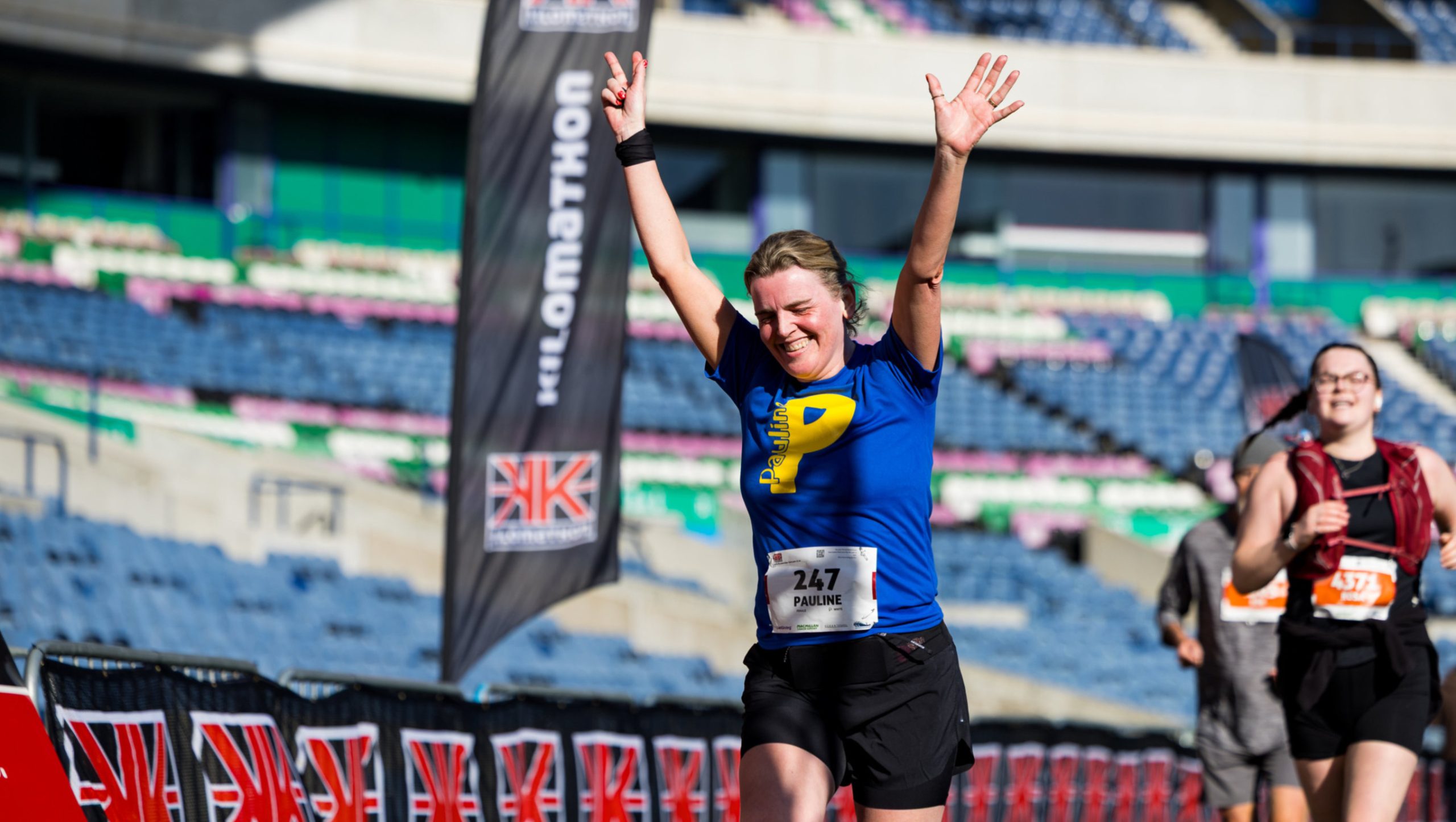 person running and cheering