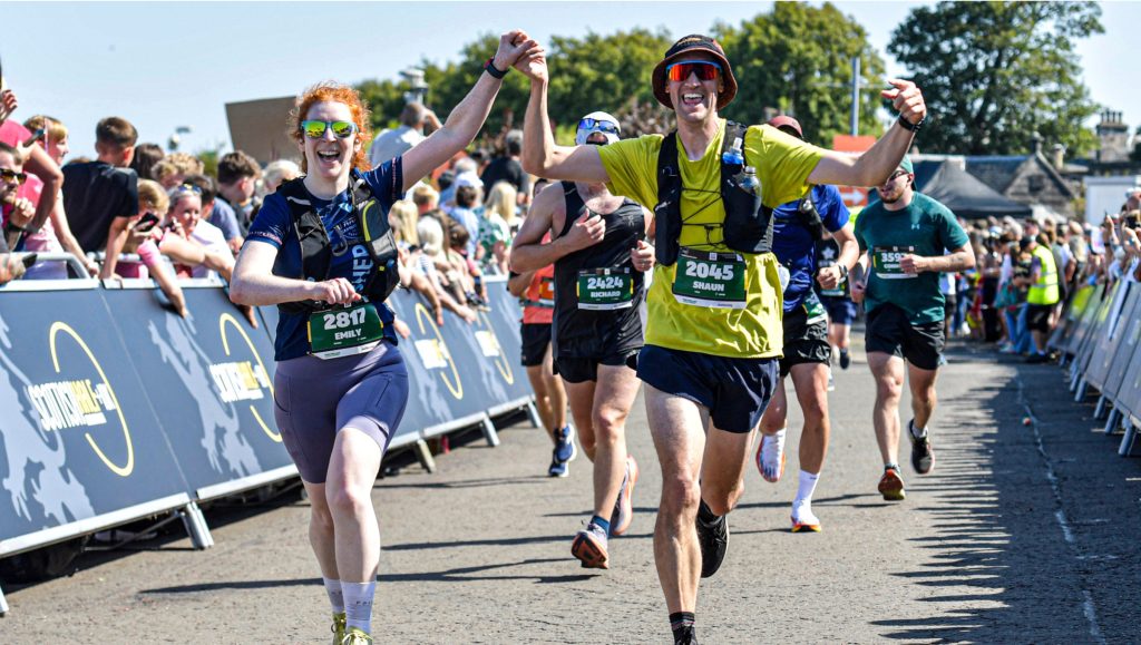 runners celebrating at the finishing line