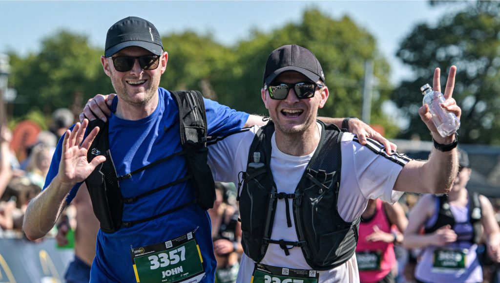 2 men celebrating at the finish line